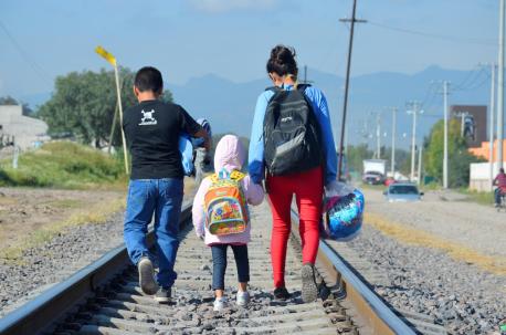 Maria, 16 (on right), from Honduras travels north with her younger siblings, expecting to cross the border to the United States to reunite with her family.
