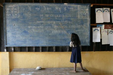 Child Writing on Blackboard
