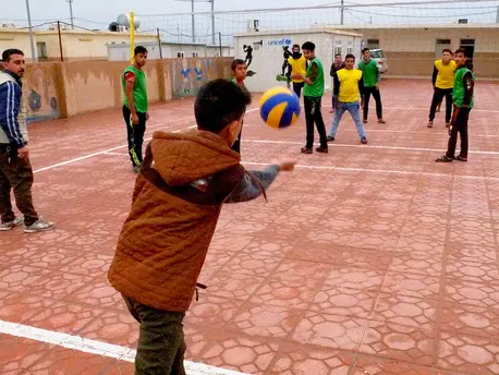 Friends play volleyball at Debaga camp in Iraq. UNICEF is working to provide counseling and education for young people affected by violence in Iraq. Friends play volleyball at Debaga camp in Iraq. UNICEF is working to provide counseling and education for young people affected by violence in Iraq.