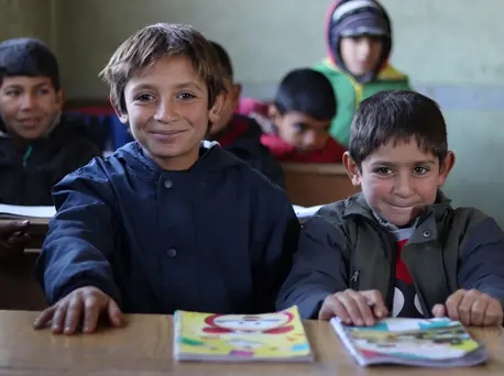 Brothers Omar, 10, and Ali, 7, attend a UNICEF-supported self-learning session in Qaramel village in northern rural Aleppo, Syria. Brothers Omar, 10, and Ali, 7, attend a UNICEF-supported self-learning session in Qaramel village in northern rural Aleppo, Syria.