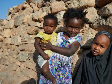 n February 2018, young girls stand outside their traditional stone home in the village of Assamo, Djibouti. 