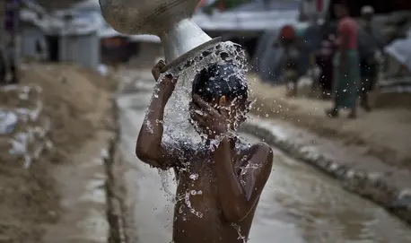 A boy washes in Balukhali, part of the refugee camp sheltering over 800,000 Rohingya refugees, Cox's Bazar, Bangladesh. A boy washes in Balukhali, part of the refugee camp sheltering over 800,000 Rohingya refugees, Cox's Bazar, Bangladesh.