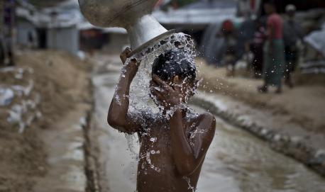A boy washes in Balukhali, part of the refugee camp sheltering over 800,000 Rohingya refugees, Cox's Bazar, Bangladesh.