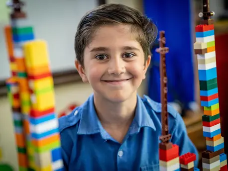 In Jordan in 2018, a Syrian refugee shows off his LEGO building skills as part of the Learning Through Play partnership between UNICEF and LEGO Foundation.