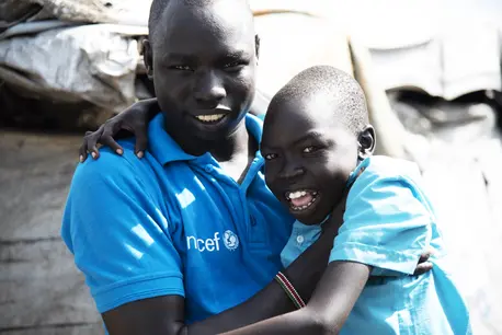 Caseworker Simon Char is checking up on 11-year-old Diech Gwang in the Protecion of the Civilian (PoC) site in Malakal, South Sudan. He has been separated from his family for four years and Simon is trying to find out if his parents are alive. Caseworker Simon Char is checking up on 11-year-old Diech Gwang in the Protecion of the Civilian (PoC) site in Malakal, South Sudan. He has been separated from his family for four years and Simon is trying to find out if his parents are alive.
