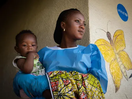 On 6 December 2018, Jemima, an Ebola survivor, cares for 6 month old Joshua at a UNICEF supported crèche in Beni, in the eastern DRC. UNICEF, Ebola, DRC