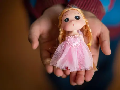 Yara, 10, still has her little doll from Syria in Za'atari Refugee Camp. Yara, 10, still has her little doll from Syria in Za'atari Refugee Camp.