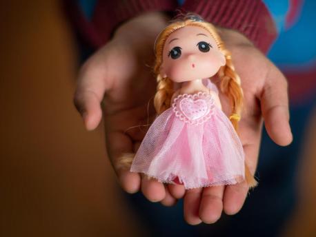 Yara, 10, still has her little doll from Syria in Za'atari Refugee Camp. 