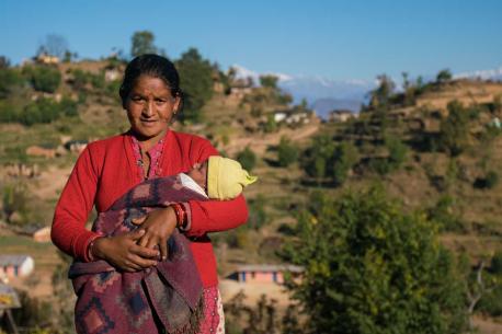 Janaki Odh with her 16-day old baby girl Nisha in Joshibunga, a village in Baitadi District, far western Nepal. Sixteen days before we captured this story, she gave birth to a baby girl, Nisha. She had a home delivery, but halfway through she noticed that