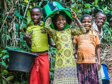 Children clown around while collecting water at a UNICEF-built pumping and distribution station near Kananga, Democratic Republic of Congo, in October 2018. Children clown around while collecting water at a UNICEF-built pumping and distribution station near Kananga, Democratic Republic of Congo, in October 2018.