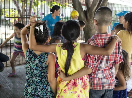 A UNICEF-supported Tech Palewi volunteer plays with children at the St. Augustine hotel for refugees and asylum seekers in Tapachula, Mexico, on January 30, 2019.