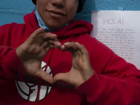 A boy reacts to a letter of support he received from a Mexican teenager at a shelter for unaccompanied migrant adolescents in Tijuana, Mexico in February 2019. A boy reacts to a letter of support he received from a Mexican teenager at a shelter for unaccompanied migrant adolescents in Tijuana, Mexico in February 2019.