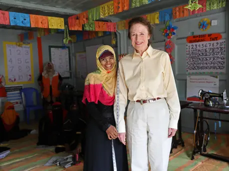 Sura, a young Rohingya refugee learning to make dresses, measures UNICEF Executive Director Henrietta H. Fore at a UNICEF-supported Adolescent Center in Cox's Bazar, Bangladesh. Sura, a young Rohingya refugee learning to make dresses, measures UNICEF Executive Director Henrietta H. Fore at a UNICEF-supported Adolescent Center in Cox's Bazar, Bangladesh.