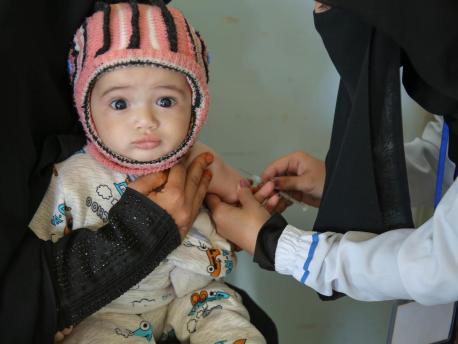A child is vaccinated at a health center in Sana'a, Yemen during a UNICEF-backed measles and rubella vaccination campaign in 2019.