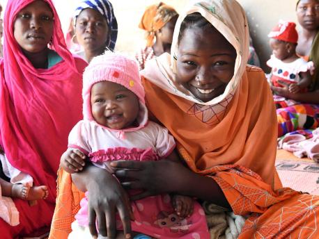 Mothers and babies wait to be vaccinated at the UNICEF-supported health center in Ambatta, a suburb of Ndjamena, the capital of Chad, in 2019. 