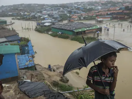 Nine-year-old Mohamed looks out over one of the canals running through Kutapalong refugee camp in Cox's Bazar, Bangladesh on July 6, 2019. Two bridges nearby were swept away by heavy monsoon rains. Nine-year-old Mohamed looks out over one of the canals running through Kutapalong refugee camp in Cox's Bazar, Bangladesh on July 6, 2019. Two bridges nearby were swept away by heavy monsoon rains.