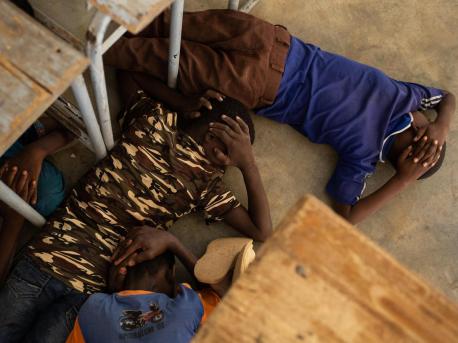 On June 26, 2019, children take part in an emergency attack simulation at the Yalgho Primary School in Dori, Burkina Faso.