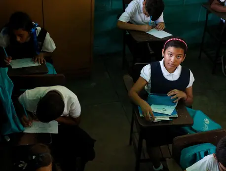 Valeria, 10, goes to a UNICEF-supported school in Maracaibo, Venezuela, where power shortages have forced teachers to shorten the school day. Valeria, 10, goes to a UNICEF-supported school in Maracaibo, Venezuela, where power shortages have forced teachers to shorten the school day.