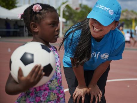 On September 14, 2019 in the Bahamas, UNICEF Emergency Response Team member Lisa Deters plays with children evacuated in the aftermath of Hurricane Dorian.