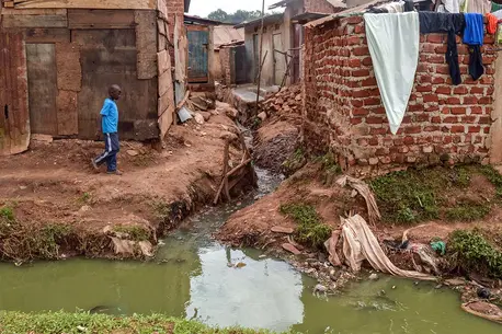 Informal settlements in Kampala City, Uganda, lack proper infrastructure and resort to using communal latrines. Informal settlements in Kampala City, Uganda, lack proper infrastructure and resort to using communal latrines.
