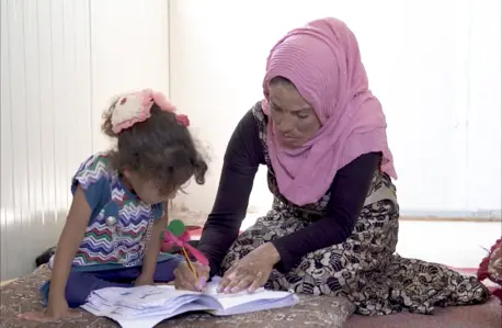 Adult Helping Child Learn