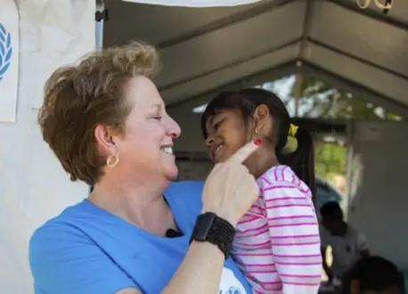 Woman Holding Small Child