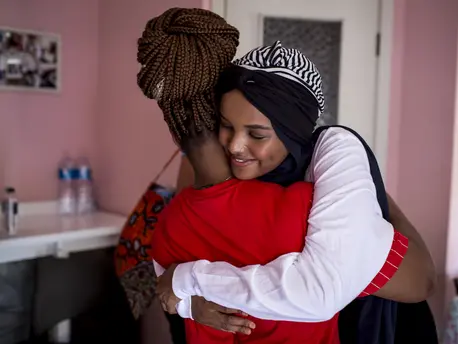 Born a refugee herself, UNICEF Ambassador Halima Aden hugs a young asylum seeker at a UNICEF-supported reception center in Palermo, Italy on August 7, 2019. Born a refugee herself, UNICEF Ambassador Halima Aden hugs a young asylum seeker at a UNICEF-supported reception center in Palermo, Italy on August 7, 2019.