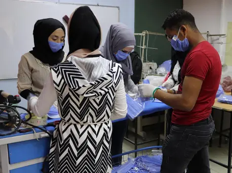 A UNICEF-supported youth center in Jaramana, Damascus, Syria trains young people to sew facial masks to protect children and families from COVID-19.