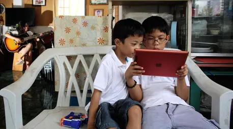 Two brothers photographed at home in Cebu, Philippines, where UNICEF works with partners to improve online safety for kids. Two brothers photographed at home in Cebu, Philippines, where UNICEF works with partners to improve online safety for kids.