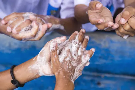 Person Washing Hands COVID