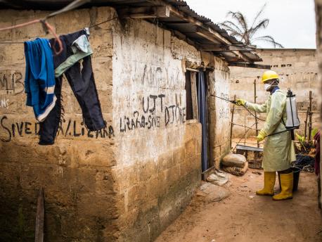 A UNICEF-supported health worker disinfects a house for cholera in the Camp Luka neighborhood of Kinshasa, Democratic Republic of the Congo, January 18, 2018.