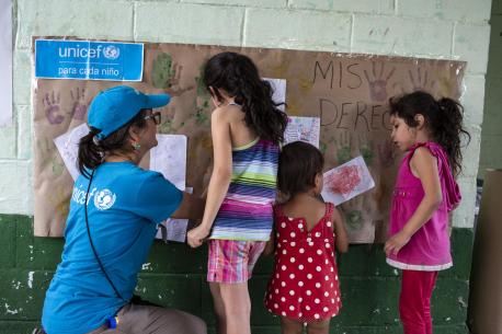 A UNICEF-supported Tech Palewi volunteer plays with children at the St. Augustine hotel for refugees and asylum seekers in Tapachula, Mexico, on January 30, 2019.