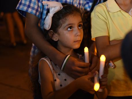 A young girl from Syria attends a candlelight vigil for child refugees at Dag Hammarskjold Plaza in New York City in September 2016.