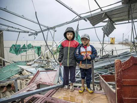 Two Children Posing in the Rain