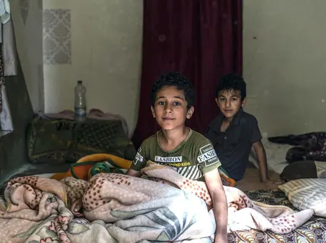Brothers Ahmad (left), 10, and Abdullah, 9, and their family, refugees from Syria, are facing another frigid winter in Jordan. UNICEF emergency cash assistance and winter clothing kits will help them survive. Brothers Ahmad (left), 10, and Abdullah, 9, and their family, refugees from Syria, are facing another frigid winter in Jordan. UNICEF emergency cash assistance and winter clothing kits will help them survive.