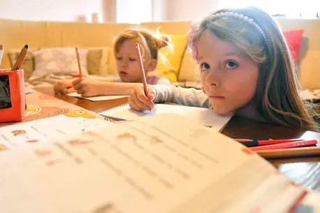 Ana and Kaja, 7-year-old twins from North Macedonia, have been learning at home since the government temporarily closed all schools in response to the spread of COVID-19. Ana and Kaja, 7-year-old twins from North Macedonia, have been learning at home since the government temporarily closed all schools in response to the spread of COVID-19.