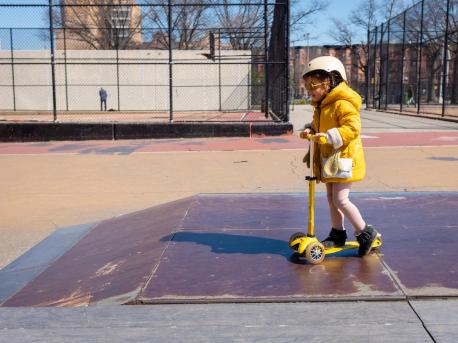 Margot, 4, rides her scooter in a park in New York City on March 26, 2020. 