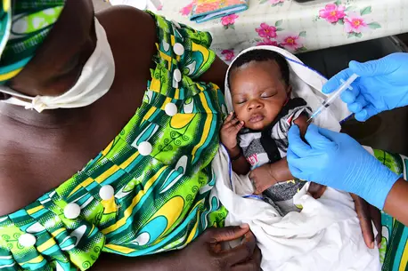 A baby is vaccinated at a UNICEF supported health center outside Abidjan, Côte d'Ivoire. A baby is vaccinated at a UNICEF supported health center outside Abidjan, Côte d'Ivoire.