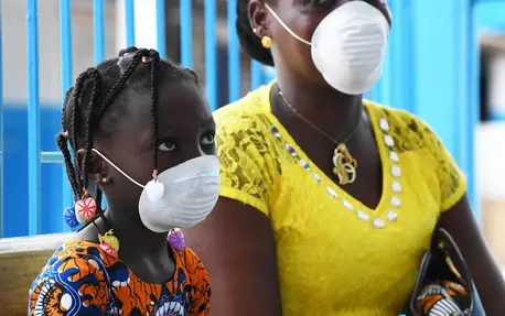 A mother and daughter wear masks during a visit to the UNICEF-supported health center outside Abidjan, in the south of Côte d'Ivoire, to protect them from COVID-19. A mother and daughter wear masks during a visit to the UNICEF-supported health center outside Abidjan, in the south of Côte d'Ivoire, to protect them from COVID-19.