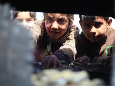 On April 5, 2020, at a tent camp in Idlib in northwestern Syria, children sift through the wreckage left when their family’s tent caught fire from a gas stove. On April 5, 2020, at a tent camp in Idlib in northwestern Syria, children sift through the wreckage left when their family’s tent caught fire from a gas stove.