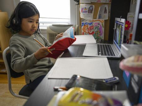 On 2 April 2020, Yolanda, 9, participates in one of her first virtual classes while studying from home in New York City, United States of America.