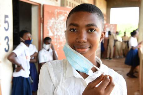 sabelle Amani, a 20 years old girl at her school in San Pedro, in the South West of Côte d'Ivoire.  Isabelle says: "I am very happy that classes resume today. I did not only missed my girlfriends enormously, but it was a waste of time and I was bored at h