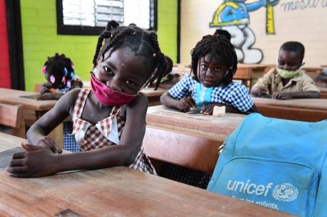Children attending classes in Toumodi-Sakassou, in the center of Côte d'Ivoire.   Due to COVID-19, the schools were closed for several weeks. Classes started, with the necessary measures. Children wear masks, wash their hands regularly and keep a social d