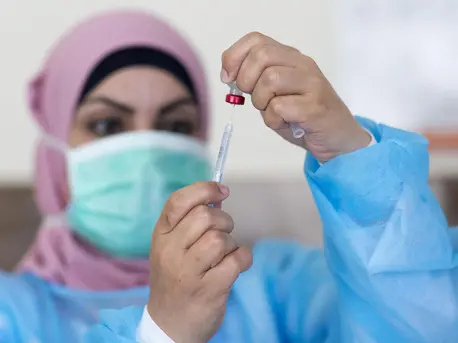 On 3 May 2020, nurse Hana Barakat prepares a vaccine at the Ministry of Health clinic in Ramallah, State of Palestine. On 3 May 2020, nurse Hana Barakat prepares a vaccine at the Ministry of Health clinic in Ramallah, State of Palestine.
