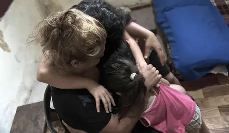 Children Hugging Adult