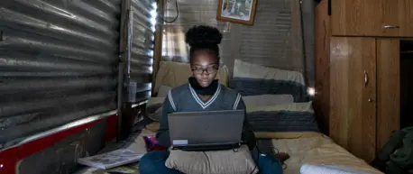 On 16 August 2020, Sebabatso Nchephe, 18, takes online classes and develops projects on her laptop, at home, a two-roomed shack she shares with her mother and two sisters in Ivory Park, an informal settlement on the outskirts of Johannesburg, South Africa On 16 August 2020, Sebabatso Nchephe, 18, takes online classes and develops projects on her laptop, at home, a two-roomed shack she shares with her mother and two sisters in Ivory Park, an informal settlement on the outskirts of Johannesburg, South Africa