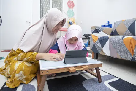 Two Children Using Computer