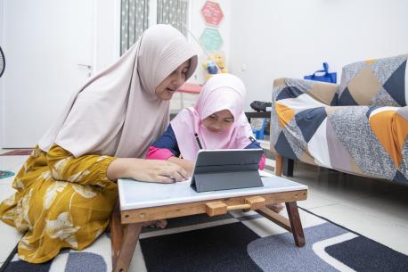 Two Children Using Computer