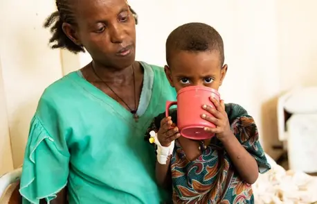 A child suffering from acute malnutrition drinks therapeutic milk provided by UNICEF as part of the ongoing humanitarian response in Ethiopia's Tigray region. A child suffering from acute malnutrition drinks therapeutic milk provided by UNICEF as part of the ongoing humanitarian response in Ethiopia's Tigray region.
