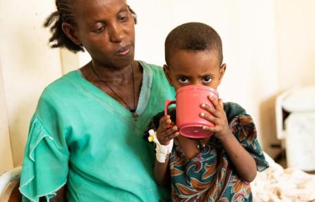 A child suffering from acute malnutrition drinks therapeutic milk provided by UNICEF as part of the ongoing humanitarian response in Ethiopia's Tigray region.
